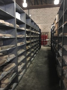 A photograph of storage space at TARL.  Similar to UTSOA's Materials Lab, TARL includes open shelving and barcodes for each item (for inventory purposes).